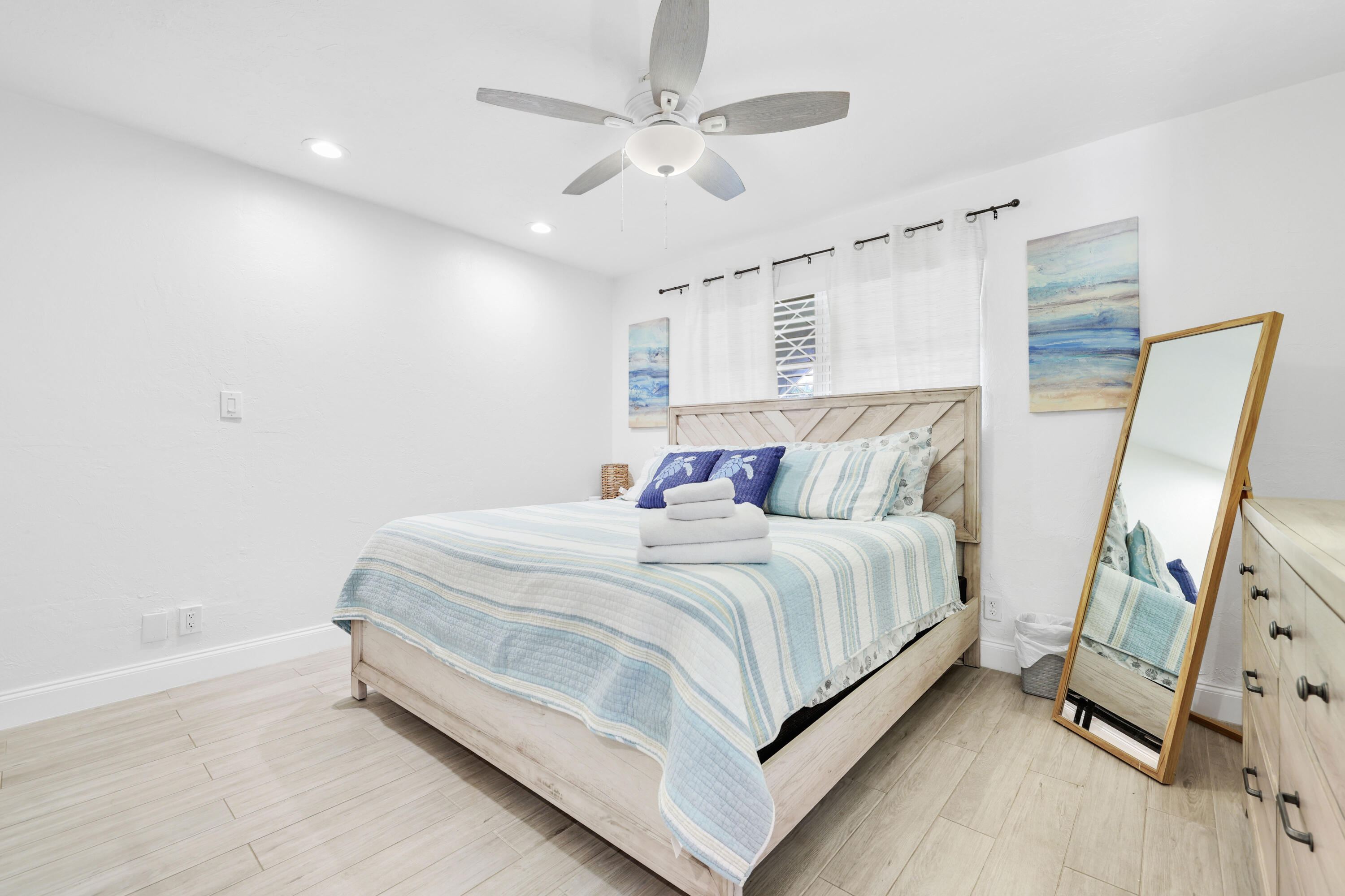 342 Southwest 14th Street Pompano Beach, FL 33060 - Photo 8 of 39 a bed room with a bed and a flat tv screen