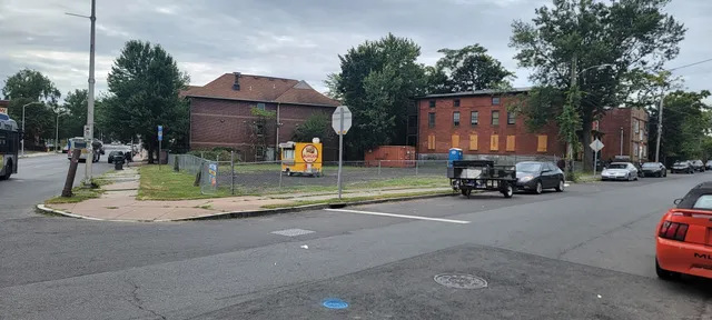 a view of a street with cars