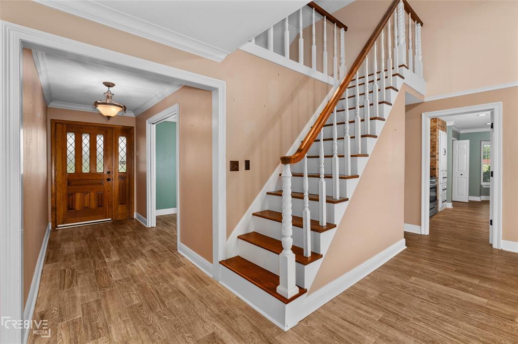 6095 Keithville-Springridge Road Keithville, LA 71047 - Photo 4 of 38 a view of entryway with wooden floor and stairs
