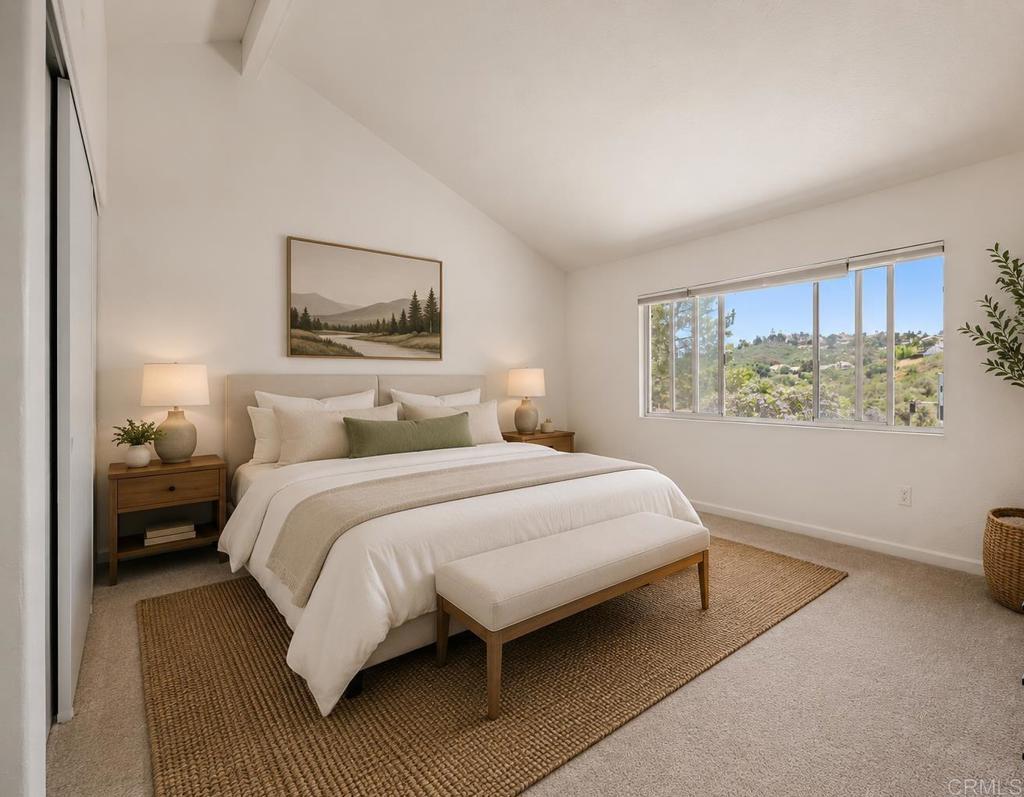 4595 Blackwell Road Oceanside, CA 92056 - Photo 25 of 47 a bedroom with a large bed and a window