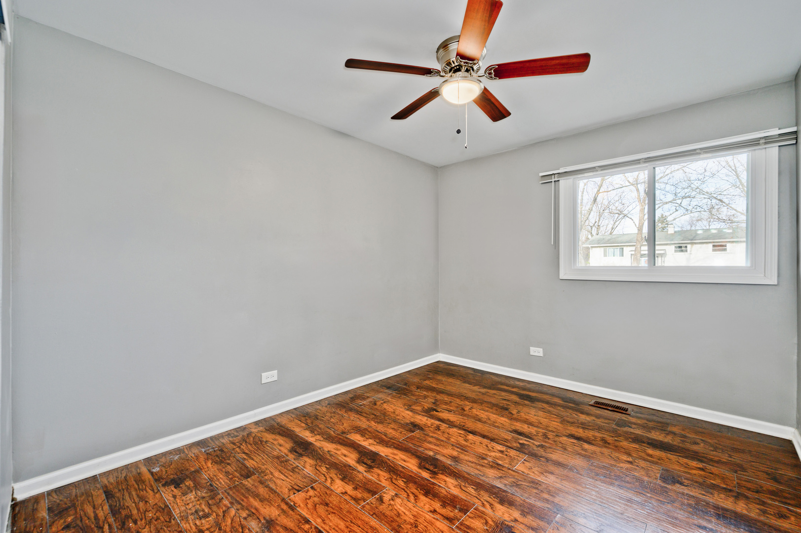 555 Jamison Lane Hoffman Estates, IL 60169 - Photo 12 of 16 a view of room with window and ceiling fan