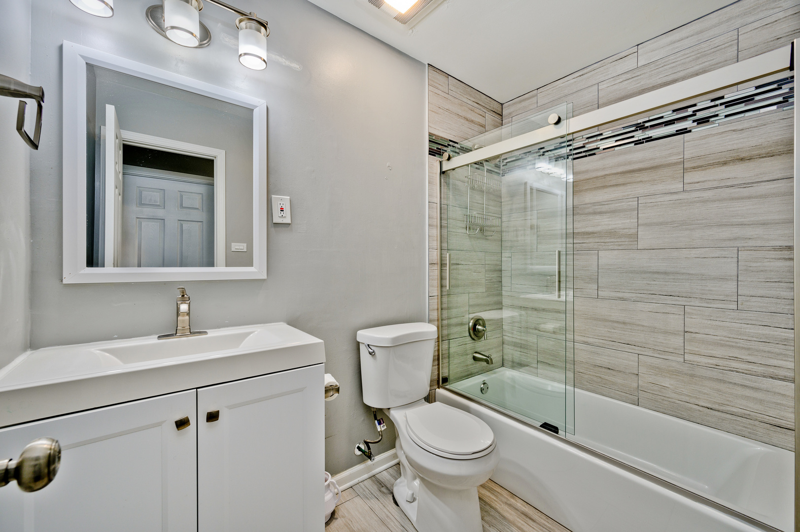 555 Jamison Lane Hoffman Estates, IL 60169 - Photo 13 of 16 a bathroom with a sink toilet and shower
