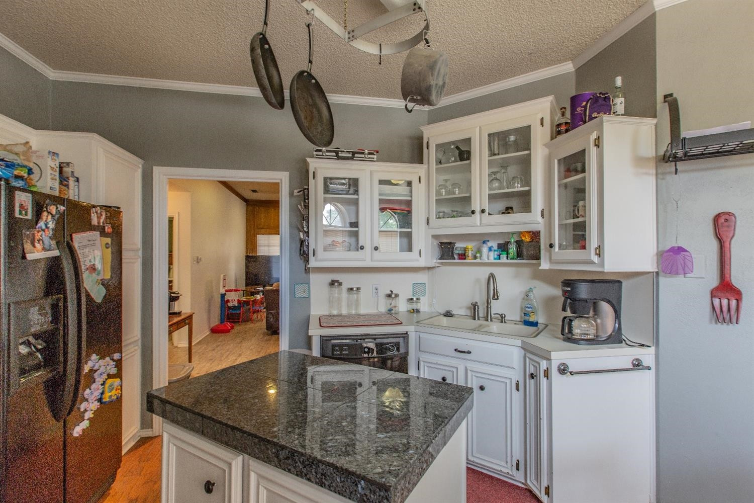 5738 94th Street Lubbock, TX 79424 - Photo 6 of 10 a kitchen with stainless steel appliances granite countertop a sink dishwasher stove and refrigerator