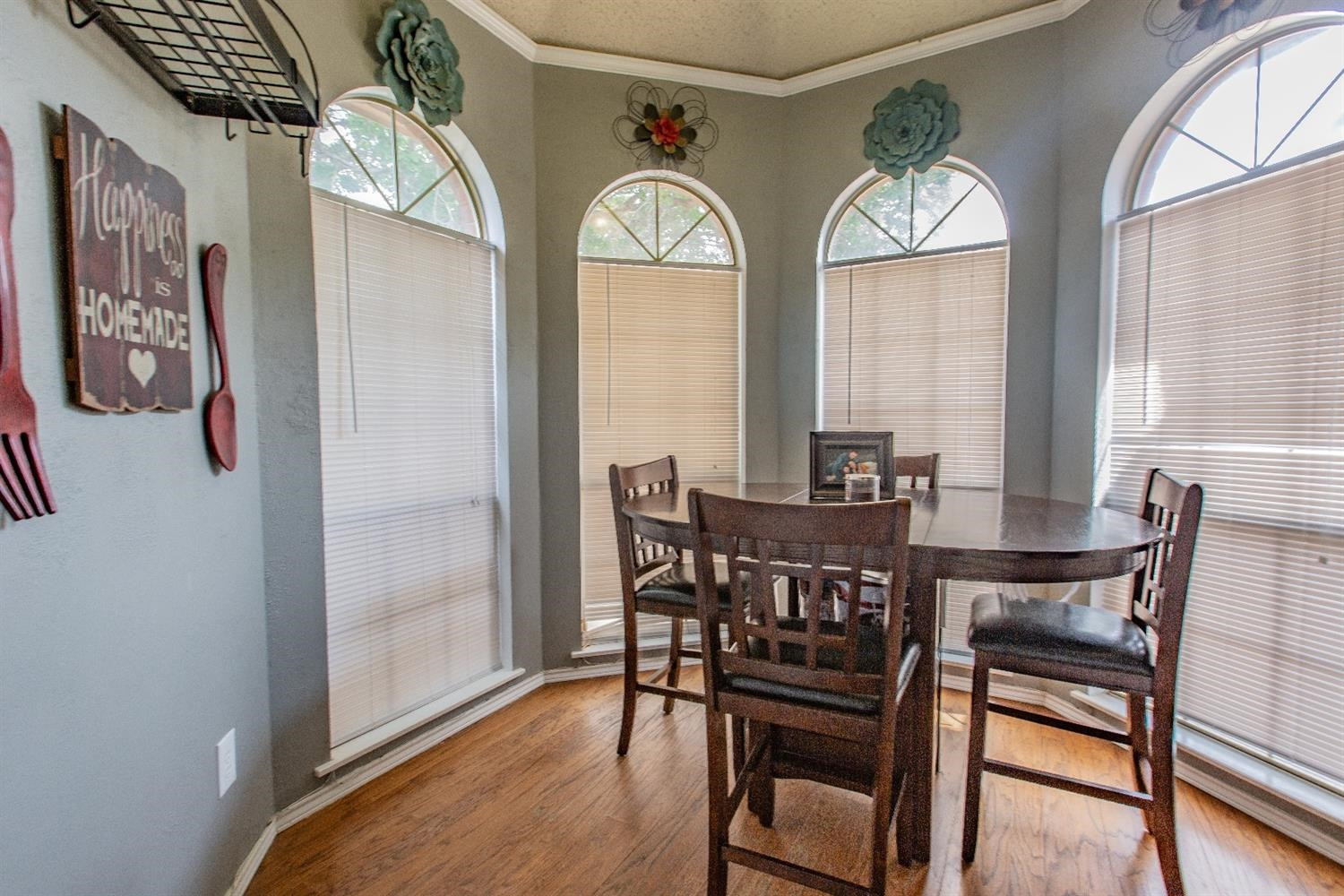 5738 94th Street Lubbock, TX 79424 - Photo 7 of 10 a view of a dining room with furniture and a chandelier