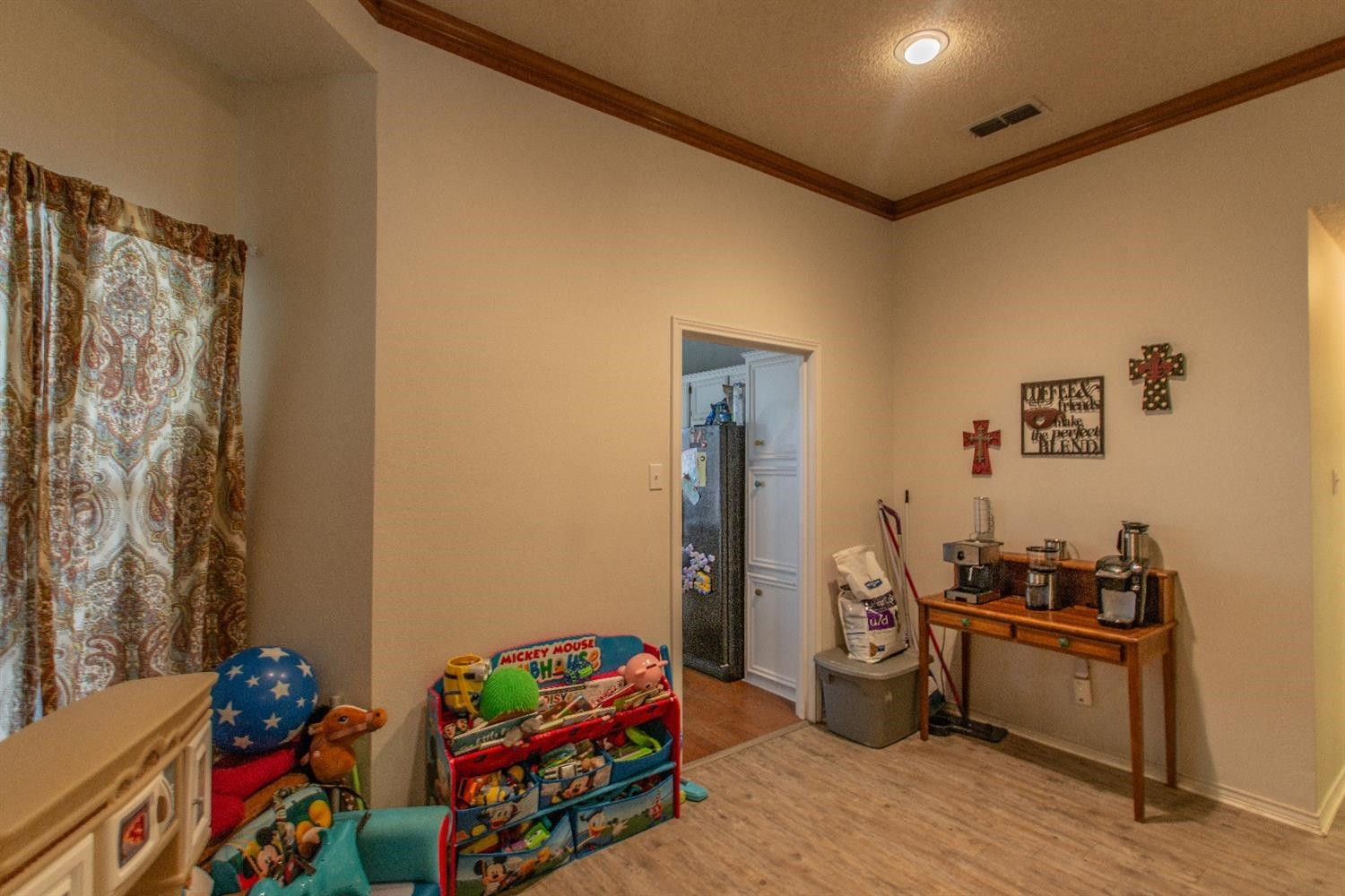 5738 94th Street Lubbock, TX 79424 - Photo 9 of 10 a bedroom with furniture and a wooden floor