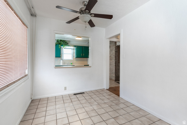 59 East Pinehurst Street Tooele, UT 84074 - Photo 6 of 22 Neutral-toned square tile flooring throughout this bright room