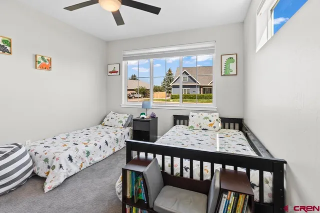 a bedroom with furniture and a window