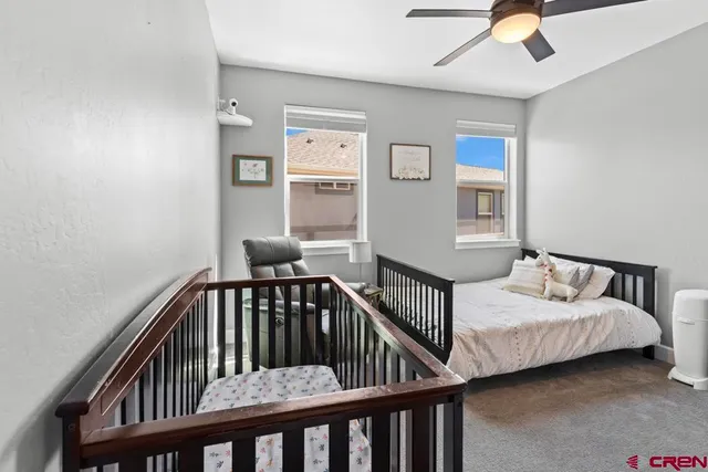 a bedroom with furniture and a window