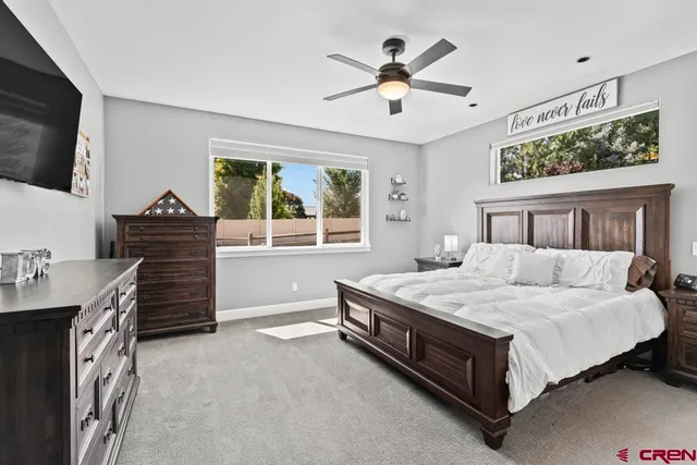 a bed room with a bed and a television