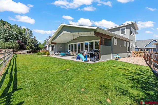 a view of a house with a yard porch and sitting area