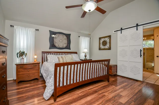a bedroom with furniture and a window