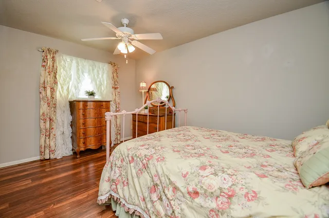 a bedroom with a bed and a dresser