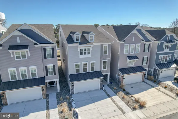 an aerial view of a house with a lake view