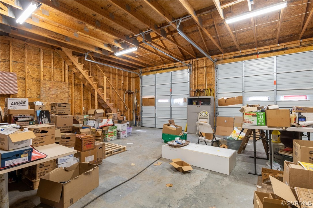 27161 Trinity Church Road Courtland, VA 23837 - Photo 31 of 47 Interior of the garage with stairs leading to additional storage upstairs