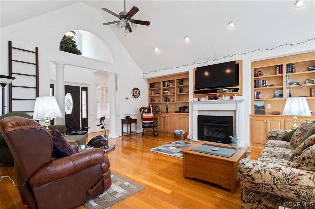 27161 Trinity Church Road Courtland, VA 23837 - Photo 10 of 47 Living room with built in bookcases and cathedral ceilings