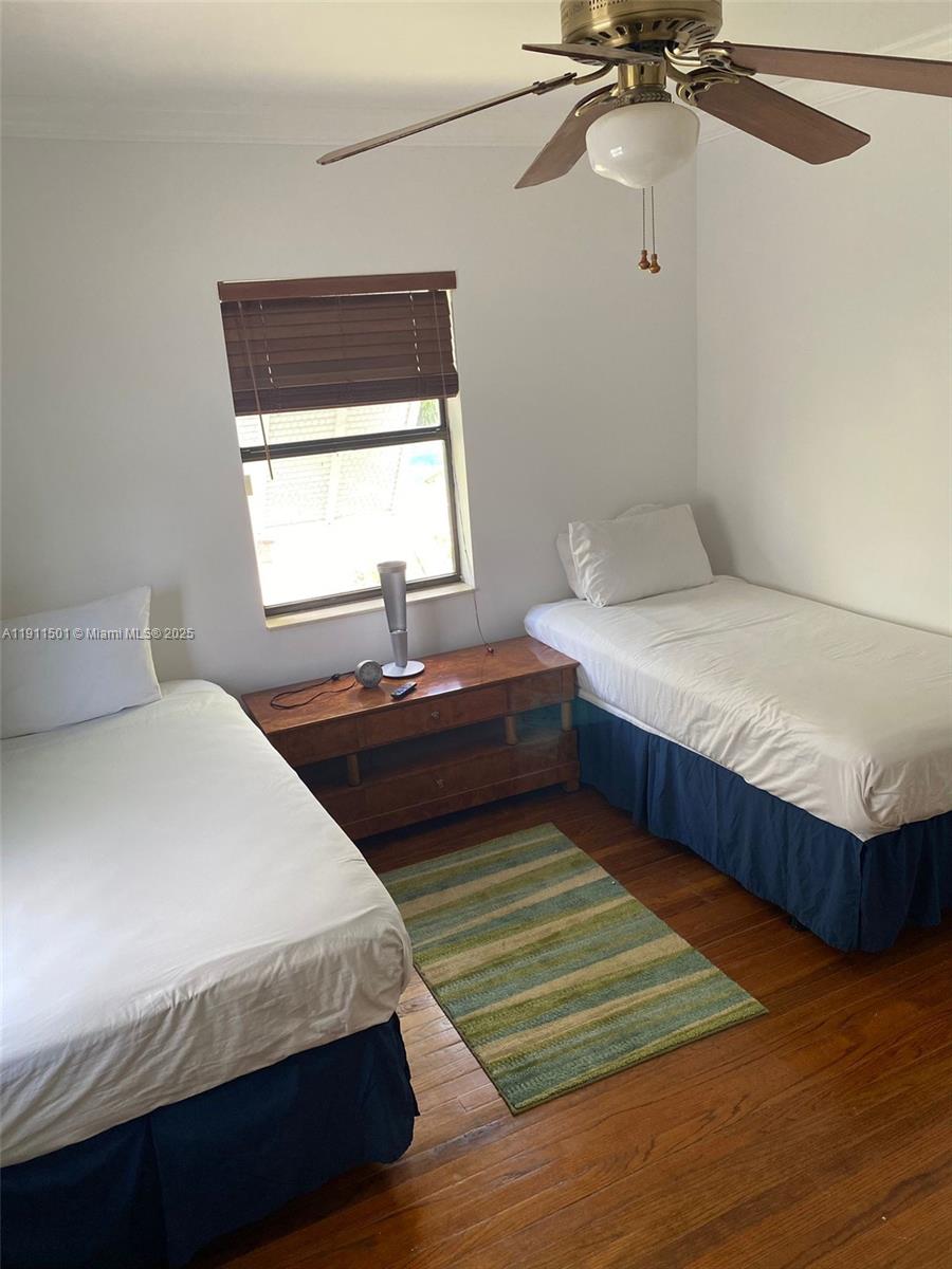 1516 Funston Street Hollywood, FL 33020 - Photo 14 of 23 a bedroom with a bed and window