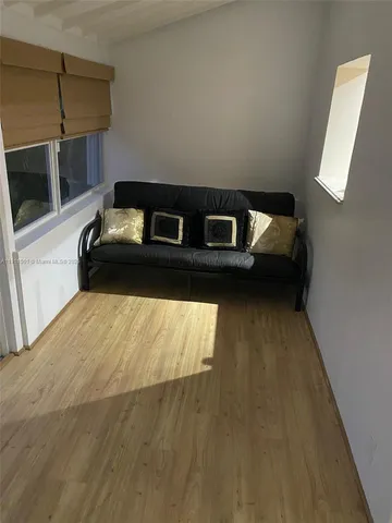 a view of a living room with a bed