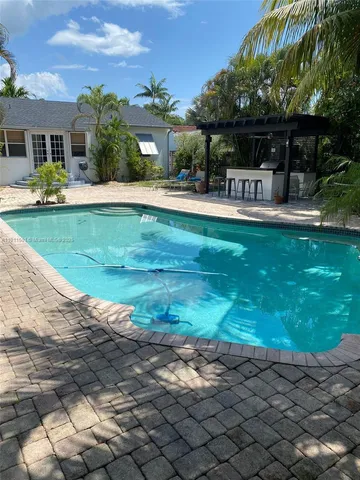 a front view of house with yard and outdoor seating