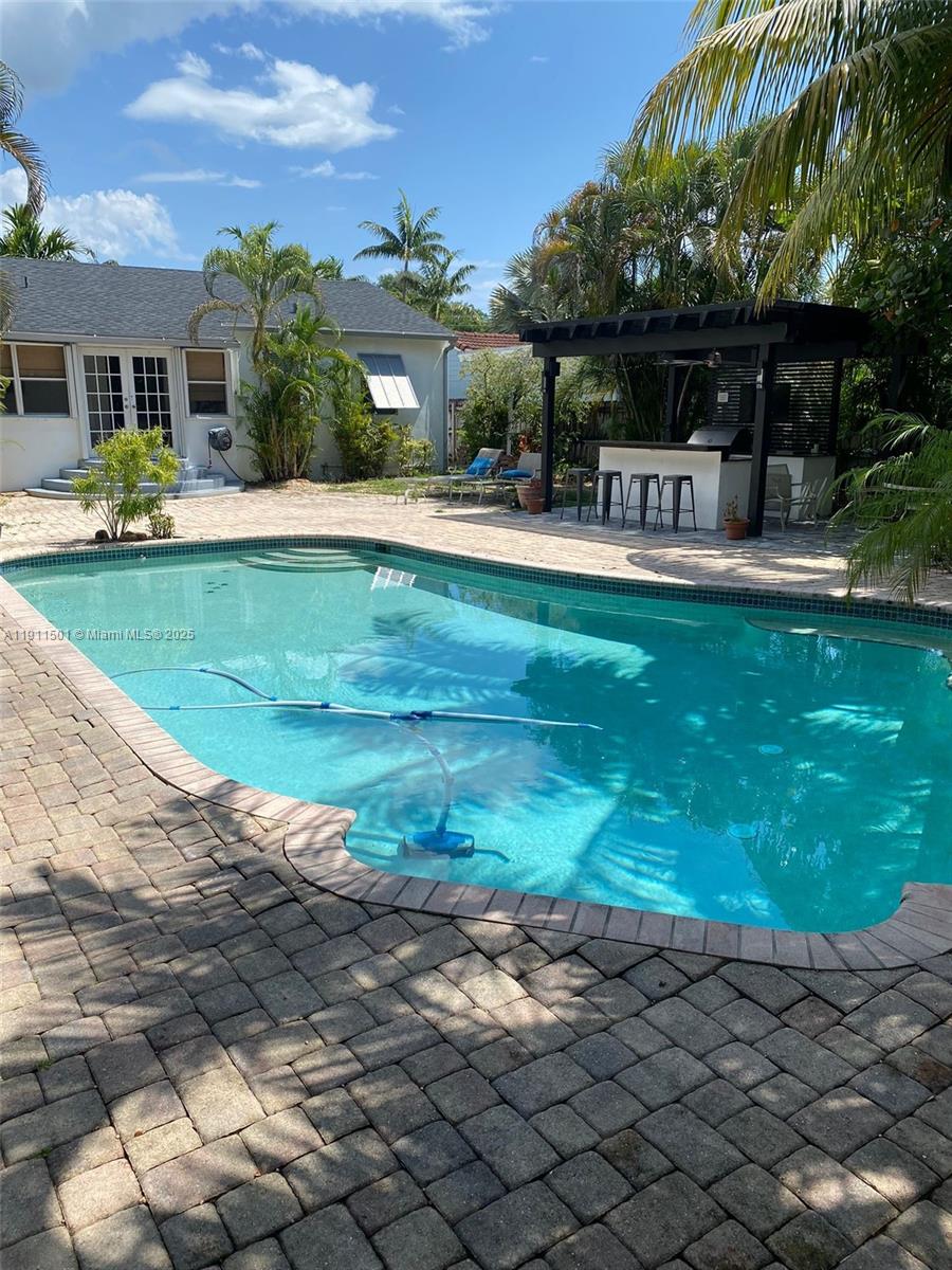 1516 Funston Street Hollywood, FL 33020 - Photo 6 of 23 a front view of house with yard and outdoor seating