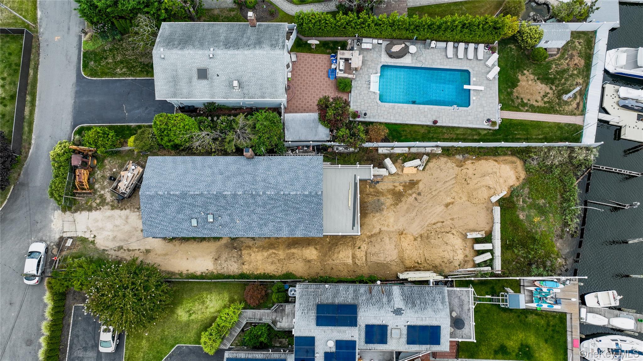 750 Shore Walk Lindenhurst, NY 11757 - Photo 3 of 21 an aerial view of a house with a yard and lake view