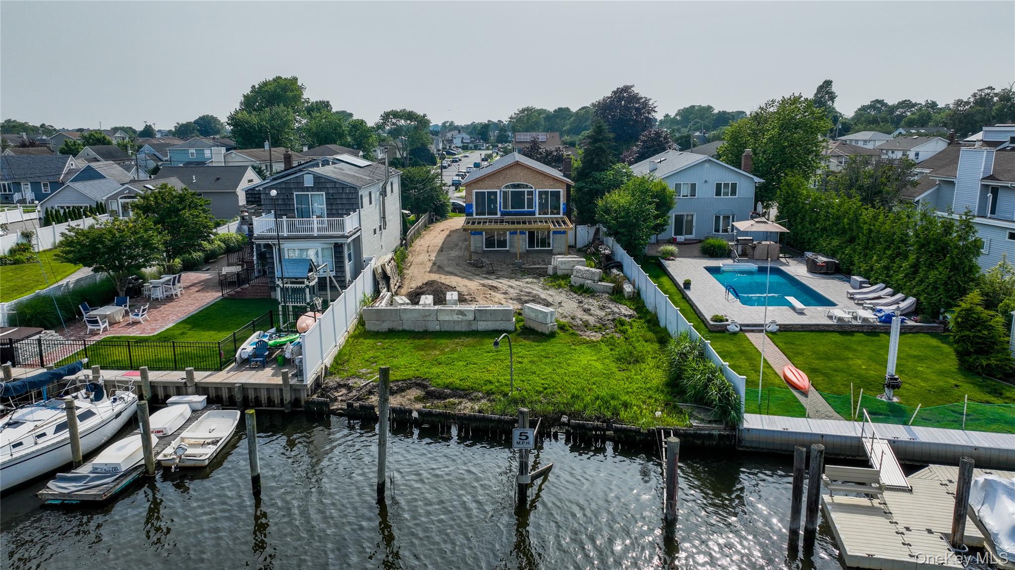 750 Shore Walk Lindenhurst, NY 11757 - Photo 4 of 21 an aerial view of a house with garden space and street view