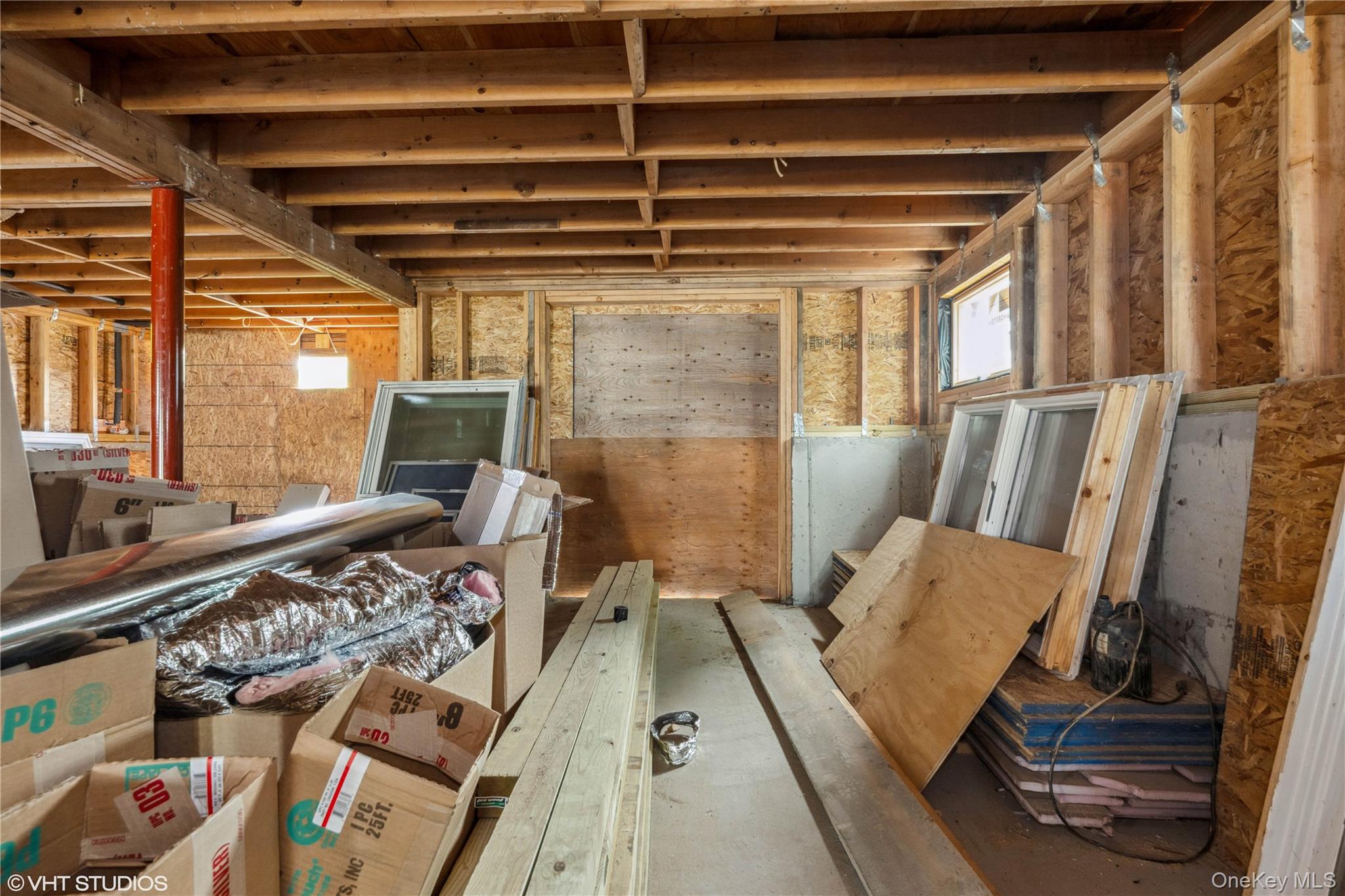 750 Shore Walk Lindenhurst, NY 11757 - Photo 8 of 21 a bed room with a bed and a couch