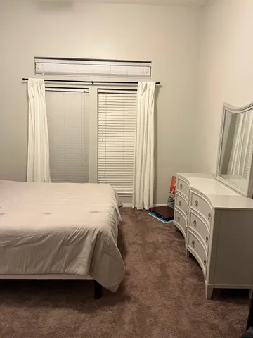 a room with furniture and a chair