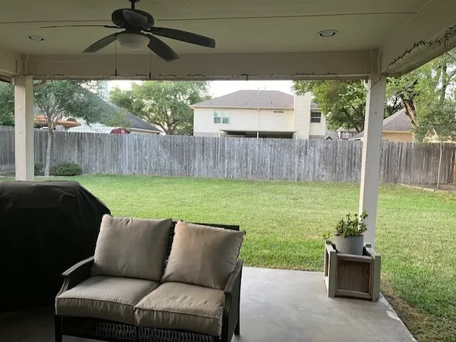 a backyard of a house with seating space