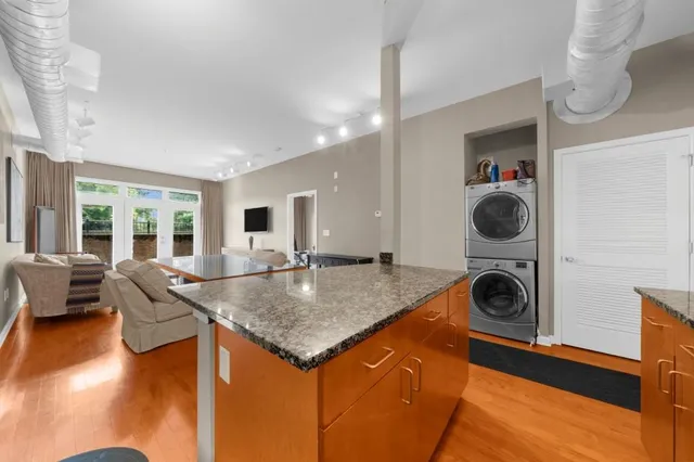 a living room with dining table and couches