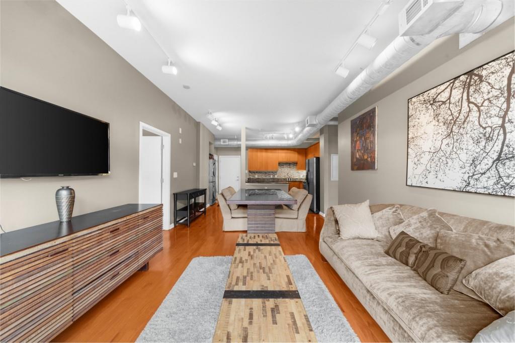 5300 Peachtree Road, Unit 1608 Chamblee, GA 30341 - Photo 20 of 47 a living room with furniture and a flat screen tv