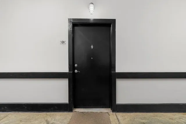 a view of a hallway with a chandelier