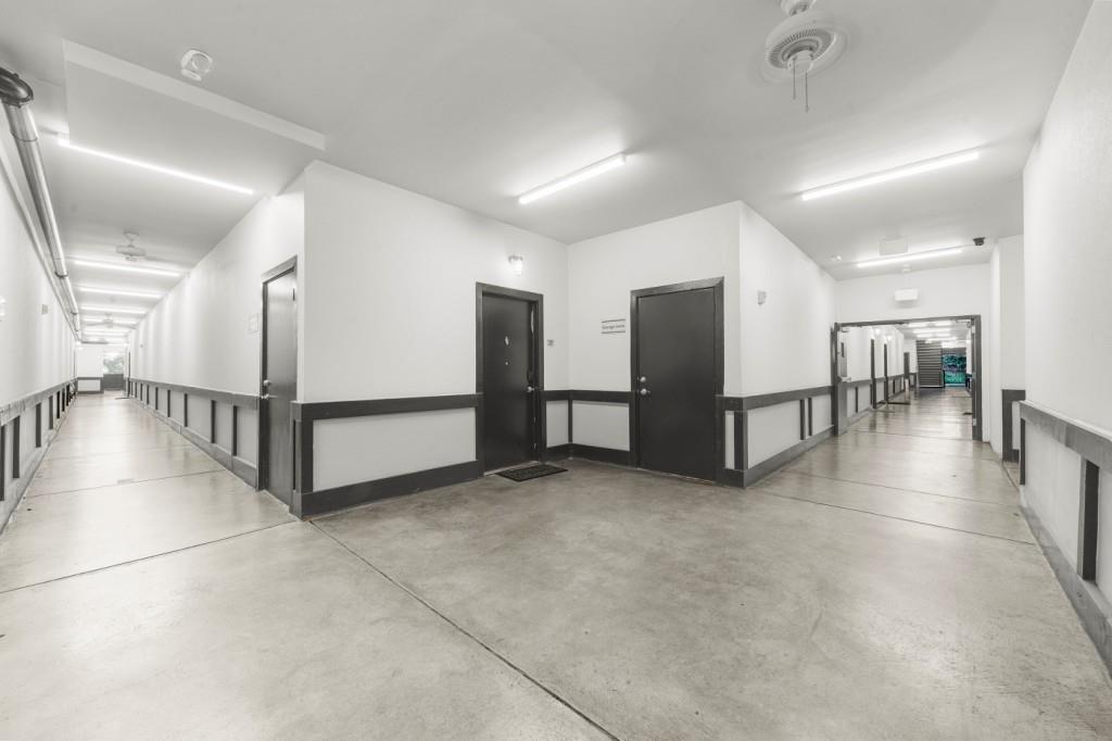 5300 Peachtree Road, Unit 1608 Chamblee, GA 30341 - Photo 31 of 47 a view of a hallway with a chandelier