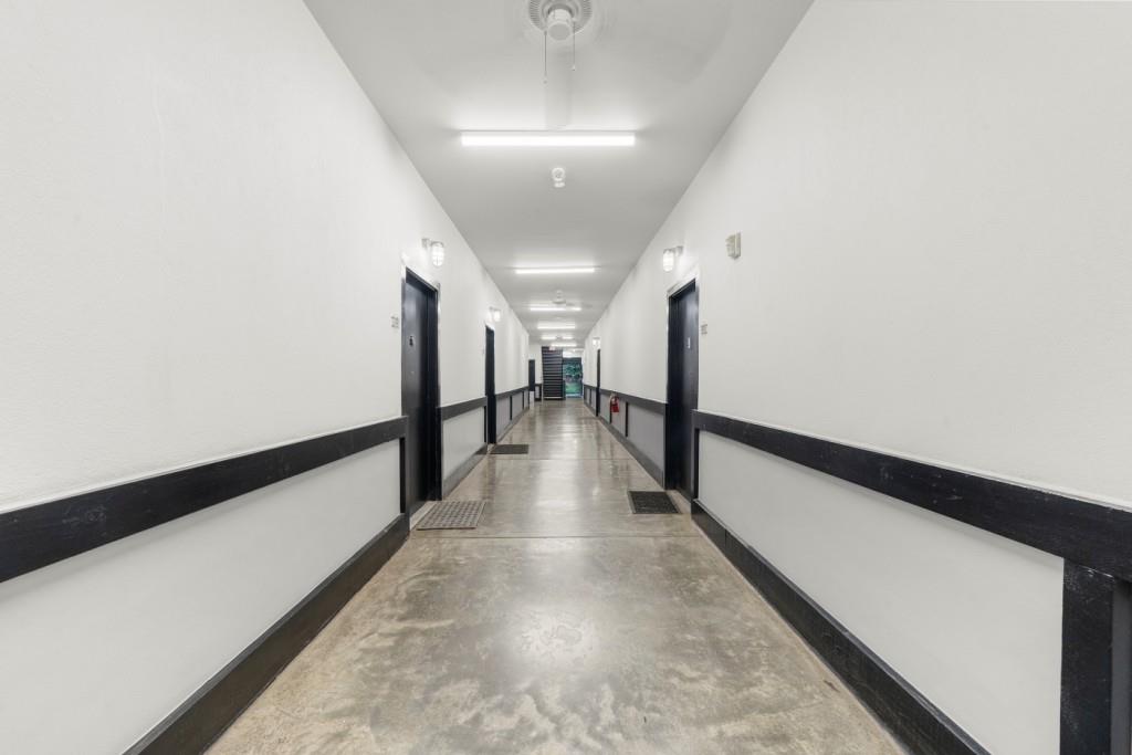 5300 Peachtree Road, Unit 1608 Chamblee, GA 30341 - Photo 32 of 47 a view of a hallway with wooden floor