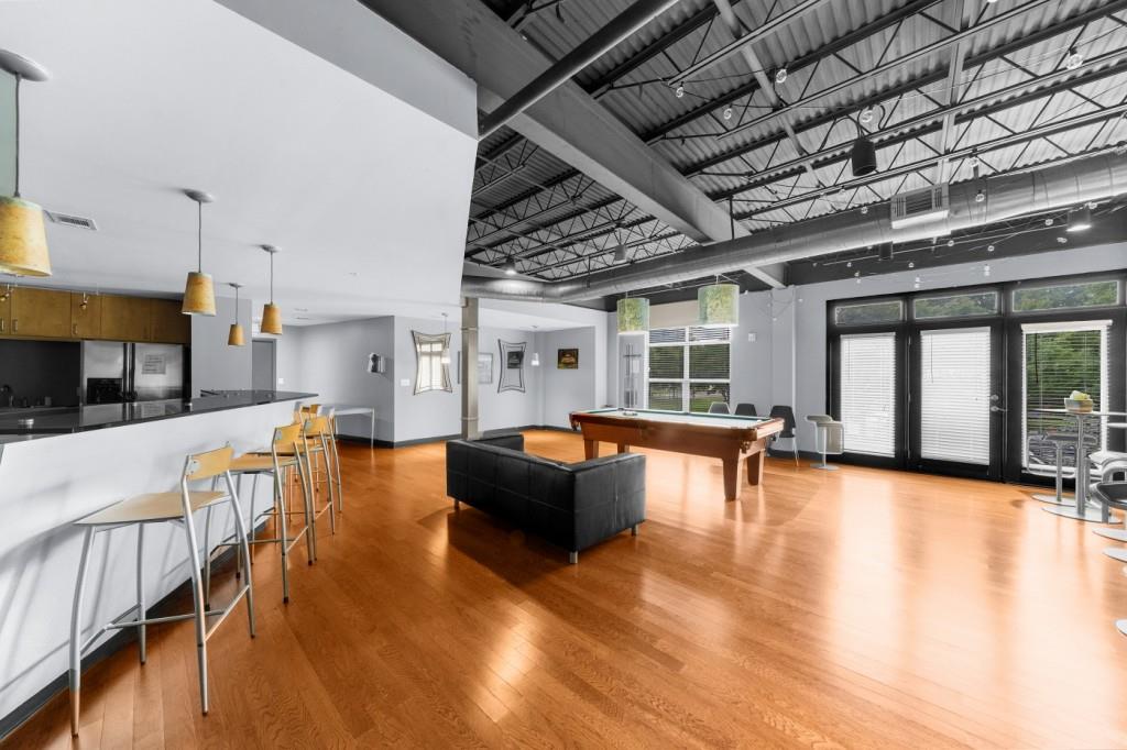 5300 Peachtree Road, Unit 1608 Chamblee, GA 30341 - Photo 34 of 47 a living room with furniture and a large window