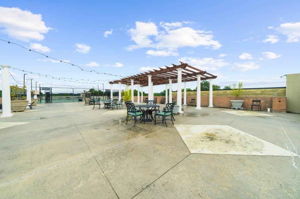 5300 Peachtree Road, Unit 1608 Chamblee, GA 30341 - Photo 38 of 47 a view of a patio with a table and chairs