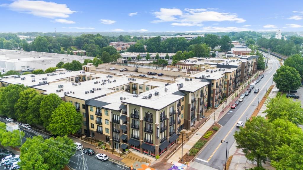 5300 Peachtree Road, Unit 1608 Chamblee, GA 30341 - Photo 45 of 47 a large building with a big yard