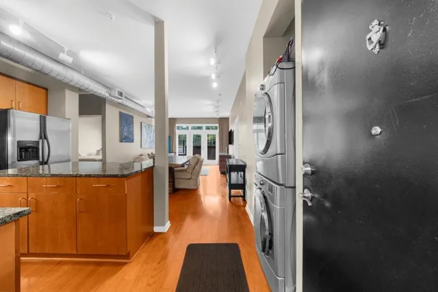 view of hall way with furniture and floor to ceiling window