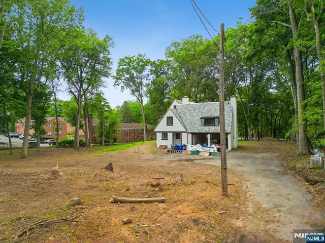 a house with trees in the background
