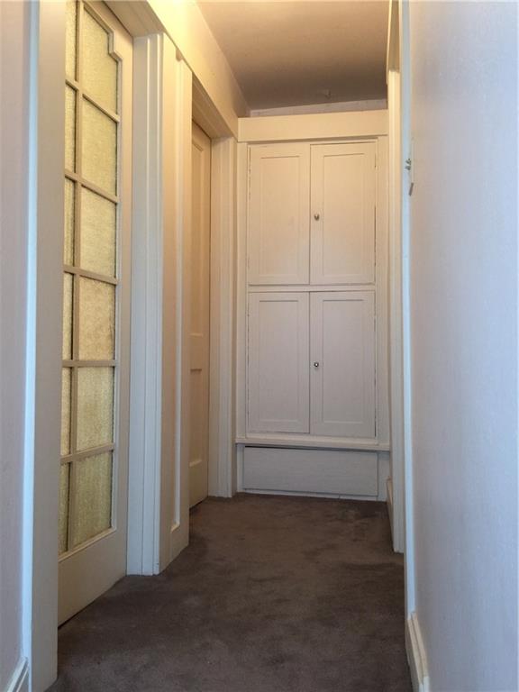 513 Walnut Road Pittsburgh, PA 15202 - Photo 12 of 19 Frosted bathroom door, and 2 bedrooms found upstairs with built-ins directly in front of you for storage.