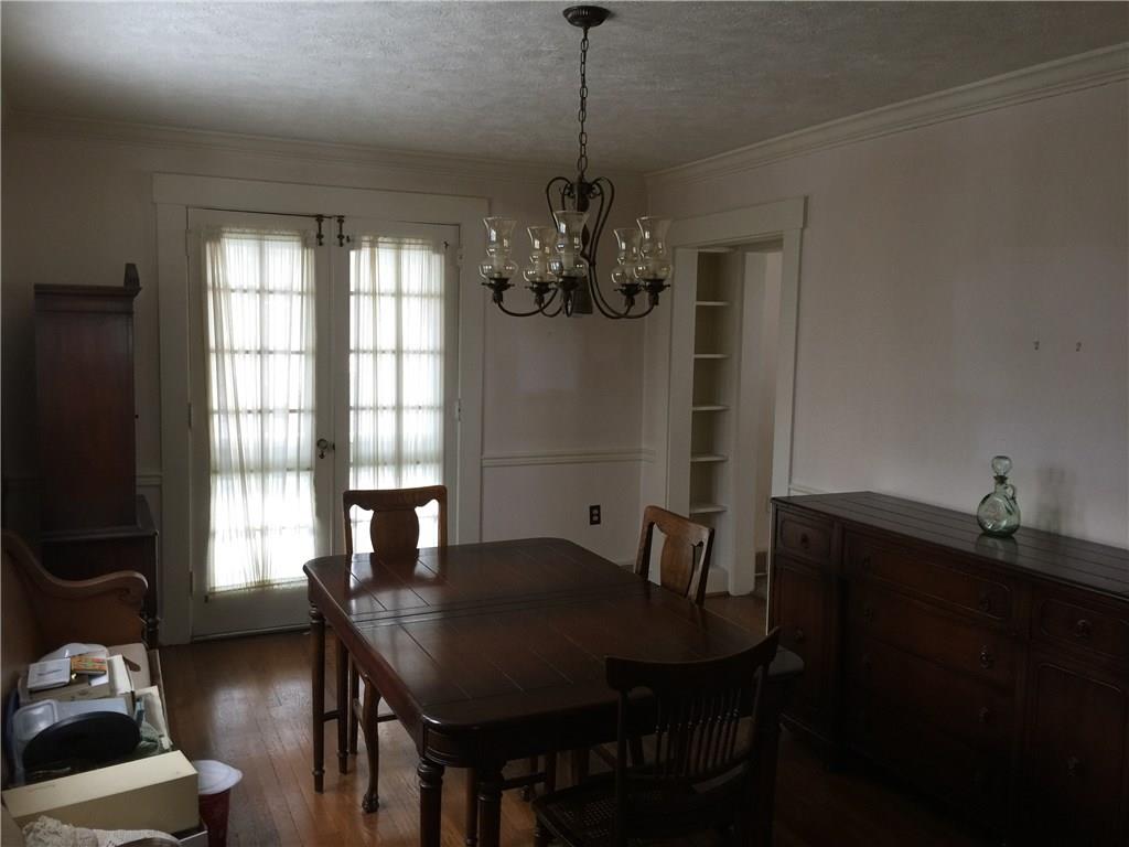 Dining Room has Crown and Chair Rail Adding Character to an already beautiful room boasting 3 windows and french doors.
