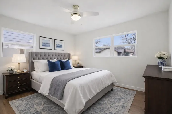 a bedroom with a bed and a desk