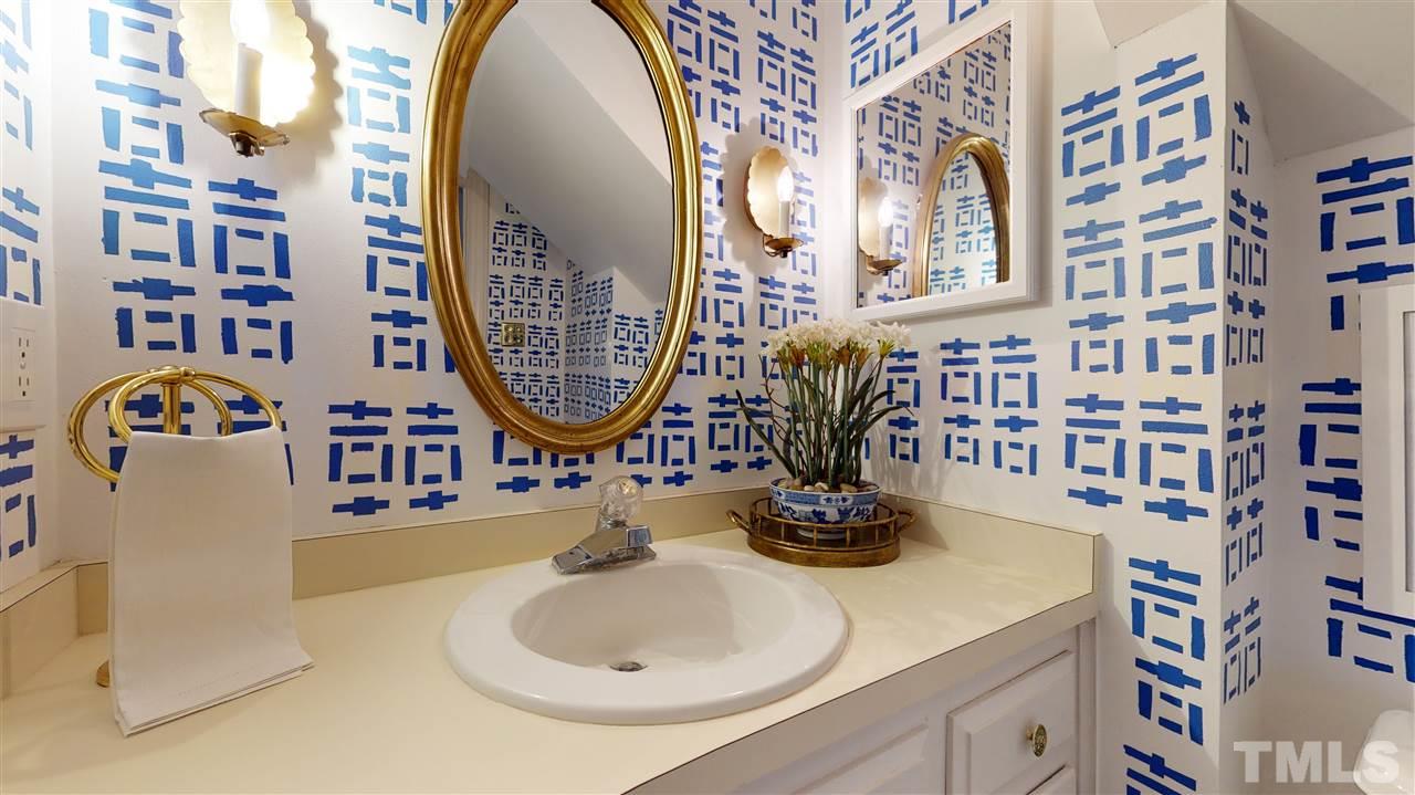 8101 Calais Court Raleigh, NC 27613 - Photo 12 of 24 a bathroom with a sink and a mirror