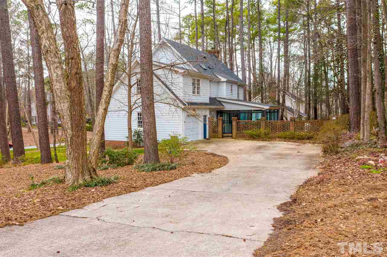 8101 Calais Court Raleigh, NC 27613 - Photo 21 of 24 a front view of a house with a yard