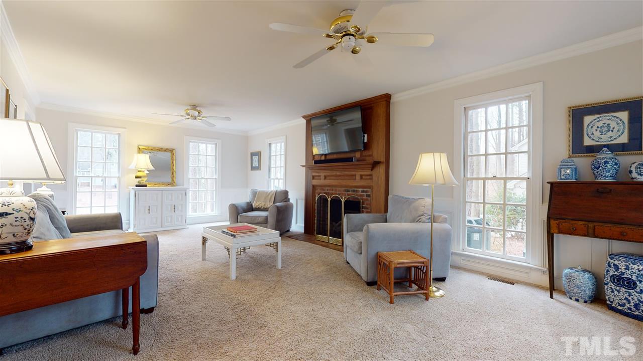 8101 Calais Court Raleigh, NC 27613 - Photo 7 of 24 a living room with furniture and a fireplace