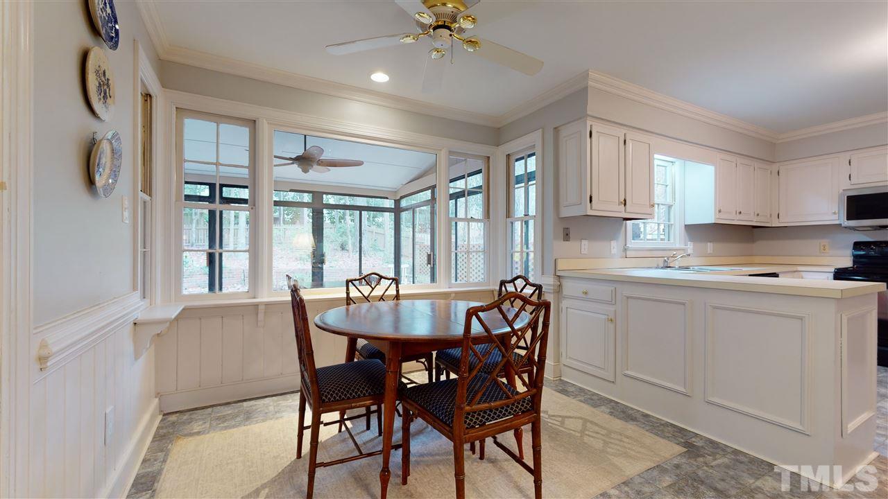 8101 Calais Court Raleigh, NC 27613 - Photo 10 of 24 a view of a dining room with furniture and window