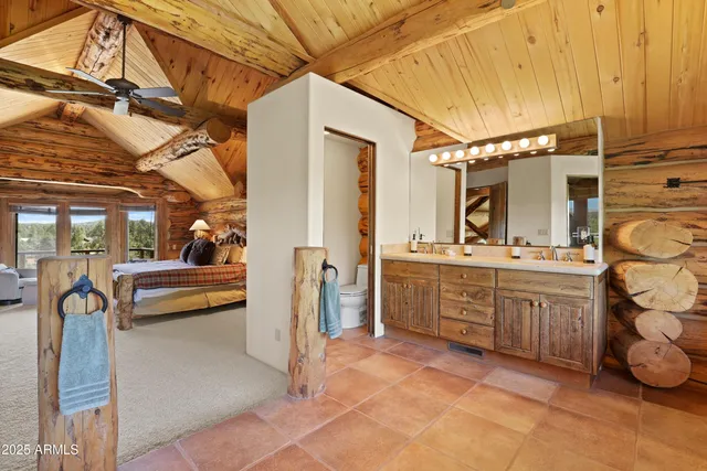 a bathroom with a sink a vanity and a bathtub