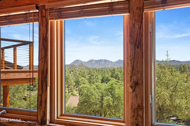 a view of balcony with wooden floor and fence