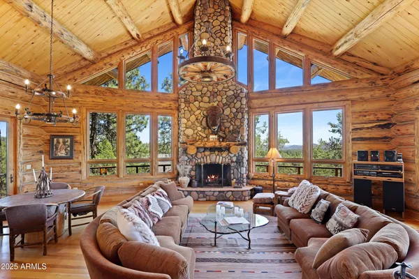 a outdoor living space with patio furniture and a fireplace