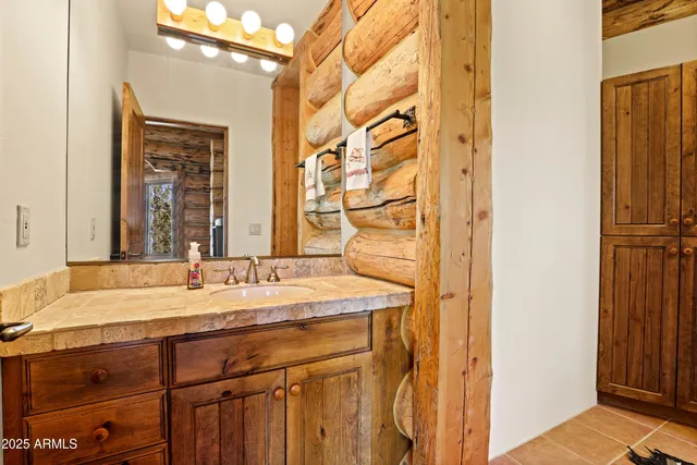 a bathroom with a toilet a sink and shower