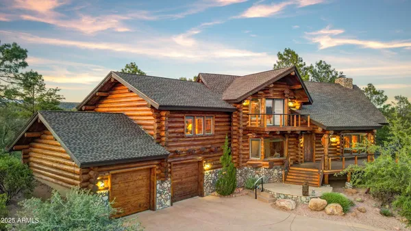 a view of a city with lush green forest